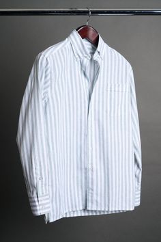 A bespoke shirt crafted from a textured cotton blend fabric in an oversized candy stripe. The larger striped pattern gives it a punch of style, making it a great casual shirt that can be worn with chinos or jeans - or under suits and jackets. The lightweight fabric drapes effortlessly, making it an ideal choice for those seeking a sophisticated yet relaxed look. Striped Relaxed Fit Shirt For Business Casual, Pinstripe Shirt For Business Casual, Long Sleeve Cotton Shirt With Horizontal Stripes, Casual Pinstripe Shirt For Business Casual, Spring Cotton Dress Shirt With Striped Collar, Striped Cotton Shirt For Work, Classic Relaxed Fit Yarn-dyed Shirt, Striped Yarn-dyed Button-up Shirt, Yarn-dyed Striped Button-up Shirt