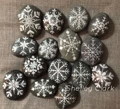 snowflakes painted on rocks are shown here