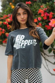 This Led Zeppelin 1968 Mothership Tee is the ultimate in rock-star style! Featuring a Led Zeppelin graphic, grinding details on the shoulders and neckline, and a boxy, relaxed fit, this tee will have you looking like a total rock god. And it's super soft too, thanks to a silicon and enzyme wash and 100% organic cotton. So, channel your inner rocker and hit the town! Color: Vintage Black Fabric: 100% Organic Cotton Model wears a small Ethically made in Los Angeles, CA