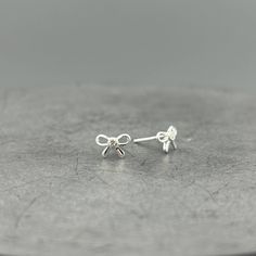 Cute Silver & CZ Bow Studs .925 Sterling Silver with a bezel set cubic zirconia. 6 x 8mm Unique Iphone Wallpaper, Fragrance Gift, Silver Stud Earrings, Accessories Bracelets, Handbag Accessories, Gold Vermeil, Sterling Silver Earrings, Silver Earrings, Accessories Hats