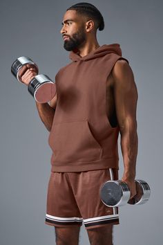 Stay cozy without sacrificing style in the Renown Sleeveless Hoodie. It has deep armholes, a kangaroo pocket, and a laid-back cut. And wait till you feel the Alo signature Renown fabric—it's smooth on the outside, a little fleecy on the side, and heavyweight for a just-right drape. Add shorts and you’re covered from the gym to the street. Sleeveless Sportswear Hoodie For Streetwear, Alo Yoga Sporty Top With Drawstring Hood, Sleeveless Hoodie For Gym In Athleisure Style, Sleeveless Fall Activewear For Workouts, Fall Sleeveless Workout Activewear, Sleeveless Activewear For Fall Workout, Hooded Alo Yoga Tops For Fall, Alo Yoga Hoodie With Kangaroo Pocket For Loungewear, Alo Yoga Hooded Top With Drawstring Hood