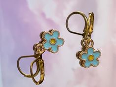 1 pair of hoops Metal Flower Charm Earrings For Spring, Metal Flower Charm Earrings, Trendy Hoop Earrings With Flower Charm For Spring, Spring Hoop Earrings With Flower Charm As Gift, Spring Flower Charm Hoop Earrings As Gift, Spring Hoop Earrings With Flower Charm, Spring Gift Hoop Earrings With Flower Charm, Trendy Metal Flower Shaped Earrings, Trendy Metal Flower Earrings