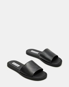 CHILL + SLEEK + CLEAN A monochrome design and a wide strap gives the flat KAYA slide its classic look. Slide sandal Slip-on style .5 inch heel height Leather upper material Synthetic lining Synthetic sole Imported Sandals Aesthetic, Steve Madden Slides, Basic Sandals, Sandals Steve Madden, Steve Madden Store, 2024 Style, Steve Madden Sandals, Black Slides, Perfect Closet