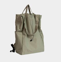 A versatile, lightweight, water-repellent bag that can be worn as a backpack, shoulder bag, or carried by hand. Tote Shoulder Bag With Removable Pouch For Outdoor Activities, Shoulder Tote Bag With Removable Pouch For Outdoor Activities, Sporty Shoulder Bag Backpack For Outdoor Use, Versatile Tote Bag For Outdoor Activities, Versatile Travel Bag For Outdoor, Nylon Travel Bag With Adjustable Strap, Nylon Travel Bag With Adjustable Strap For Daily Use, Versatile Rectangular Shoulder Bag For Outdoor Activities, Nylon Shoulder Travel Bag With Adjustable Strap