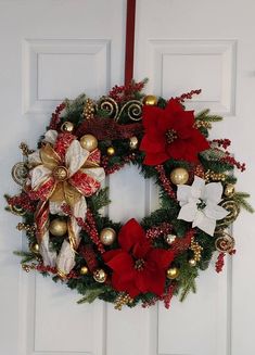 a christmas wreath hanging on the front door