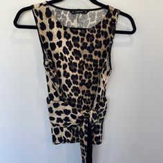 Nwot Zara Animal Print Crew Neck Sleeveless Top. Ties At Waist. Size Xs. Never Worn. Excellent Condition Fitted Brown Sleeveless Tank Top, Brown Sleeveless Tank Top For Night Out, Sleeveless Brown Tank Top For Night Out, Chic Brown Vest Top, Fitted Sleeveless Brown Top, Brown Sleeveless Top For Night Out, Sleeveless Brown Tops For Night Out, Chic Leopard Print Cami Top, Casual Leopard Print Sleeveless Tank Top