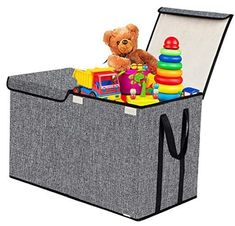 a toy chest with a teddy bear and toys in it's top compartment,