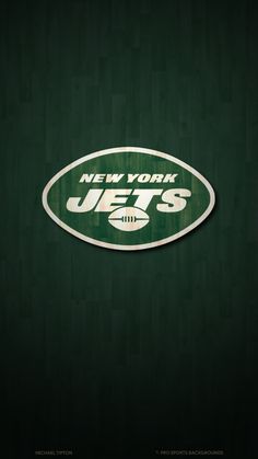 the new york jets logo is shown on a dark green wood paneled wallpaper