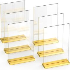 three clear and gold shelfs are stacked on top of each other