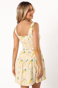 DETAILS   Sashay into summer with the Cintrico Mini Dress in Lemon! This playful piece features a chic round neckline and non-adjustable straps for a sleek silhouette. The tie close detail on the bust adds a flirty touch, while the shirred elasticised waistband ensures a comfortable, flattering fit.    mini length   round neckline  non adjustable straps  tie close detail on bust  shirred elasticised waist band  invisible side zip with hook and eye clasp  a-line skirt design  lemon print design Satin Dresses Long, Satin Dresses Long Sleeve, Spring Wedding Guest, Black Tie Wedding Guests, White Dress Shoes, Essential Dress, Resort Dresses, Bridesmaid Outfit, Lemon Print