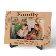 a family picture frame with the words, where life begins and love never ends