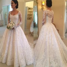 a woman in a white wedding dress looking at herself in the mirror with her hand on her hip