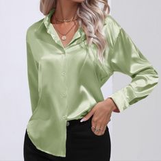 The Satin Serenity Button-Up Shirt Is A Refined And Elegant Choice For Any Occasion. With Its Collared Neck And Buttoned Front, It Exudes A Timeless Sophistication. The Satin Fabric Adds A Touch Of Luxury And A Subtle Sheen, Making It Suitable For Both Formal And Semi-Formal Settings. This Shirt Is Perfect For Creating A Polished And Put-Together Look. Material: 100% Polyester Measurements Provided Are Approximate And May Exhibit Variations From The Values Listed. S: Shoulder 16.8 In, Bust 42.1 Luxury Solid Color Semi-formal Shirt, Elegant Luxury Semi-formal Dress Shirt, Luxury Timeless Semi-formal Dress Shirt, Luxury Elegant Silk One-shoulder Dress, Green Satin Top With Jeans, Luxury Formal Dress Shirt, Luxury Green Button-up Blouse, Cheap Green Blouse With Button Closure, Green Satin Blouse