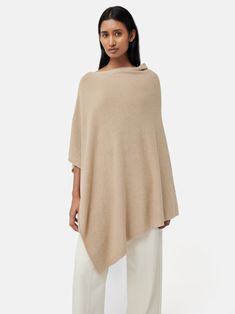 For a poncho in an unbelievably soft, wool cashmere blend, that drapes over your shoulders for effortless elegance, look no further than our classic poncho crafted in Italy. Featuring a cowl neckline falling into an asymmetric hem and arriving in three timeless colours. Layer yours over lightweight knits, t shirts and blouses for a touch of cosy chic. Essential Wardrobe, Upcycled Fashion, Cowl Neckline, Effortless Elegance, Cashmere Wool, Soft Wool, Knitwear Women, Layering Pieces, Asymmetric Hem