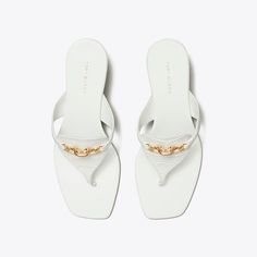 The silhouette of a flip-flop is reimagined with trapezoidal side straps, designed to beautifully frame the foot. A scaled-down take on Jessa's horsehead hardware embellishes the croc-embossed leather upper. Finished with a gold-tipped low kitten heel. Gold Tips, Low Heel Sandals, Heeled Sandal, Footwear Design Women, Designer Sandals, Sandal Fashion, Kitten Heel, Espadrilles Wedges, Strap Heels