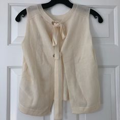 Brand New With Tags. Designer Size 1. Cream Colored. Chic Spring Sweater For Daywear, Chic Spring Daywear Sweater, Elegant Spring Sweater For Daywear, Elegant Sweater Vest For Spring Layering, Elegant Spring Sweater Vest For Layering, Chic Cream Knit Top For Spring, Spring Beige Cashmere Tops, Beige Cashmere Tops For Spring, Elegant Spring Cashmere Top