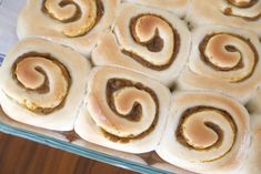 rolls with peanut butter filling in a glass baking dish