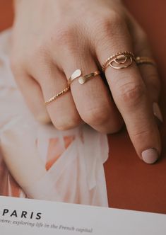 An updated version of our cuff ring. This time we made the ends pass by one another. Inspired by the definition of sonder: the realization that each random passerby is living a life as vivid and complex as your own. 14g wire is hand-shaped and hammered for texture. Available in 14kt Gold Fill + Sterling Silver. Shown with our Confetti Rings and Raye Ring. Handmade in Eau Claire, WI All of our jewelry is handmade to order so each piece will be unique and may vary slightly from what is pictured. Everyday Hammered Open Ring, Unique Hammered Rings For Everyday Wear, Adjustable Hammered Jewelry For Promise, Modern Adjustable Midi Rings For Promise, Unique Everyday Jewelry Open Band, Unique Everyday Rings With Open Band, Unique Everyday Open Band Rings, Unique Open Band Jewelry For Everyday, Unique Open Band Rings For Everyday