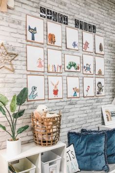 there are many pictures on the wall in this room, and one has a basket