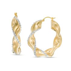 From the Diamond Fascination™ Collection, these striking twist hoop earrings add drama to your wardrobe. Fashioned in 14K gold over a resin core, each 30.0mm hoop is a chic sculpted 5.0mm-wide ribbon edged with diamond enamel pavé. Diamond Fascination™ jewelry shimmers with a diamond accent and a pavé of diamond dust crystallized into enamel - a patented handmade process that results in a high-end look. Buffed to a brilliant luster, these earrings secure with latch backs. Modern Twist Hoop Earrings For Anniversary, Twisted Ribbons, Twist Hoop Earrings, Ribbon Jewelry, Jewelry Design Drawing, Diamond Dust, Buying Diamonds, Chic Jewelry, Girly Jewelry