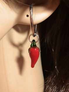 "In New Mexico Chile is a staple in our diets, both Red and Green.  In fact, New Mexico is the only state with a State Question: \"Do you want Red or Green with that?\" To celebrate the annual Chile Harvest, Lisadora offers a darling handmade glass Chile Pepper as an earring.  Red chile pods with green stems.  These are completely made by hand, and while we strive to match each pair as closely as possible for color, shape, and size, there will be slight differences, just as there would be in nat New Mexico Chile, Red Chile, Chile Pepper, Red Pepper, Sterling Silver Hoops, Glass Earrings, Silver Hoops, New Mexico, Etsy Earrings