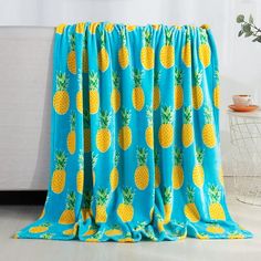 a blue and yellow pineapple print curtain