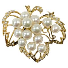 14 Karat Yellow Gold Pearl Cluster Leaf Brooch. This brooch features thirteen 6.5 and 7mm cultured pearls. The pearls are white with pinkish tones and they have good clean luster with only light blemishes. The pearls are set atop a gold leaf outline shape with milgrain detail and seed pearls all around. Stamped on the back of the brooch is K14. The brooch/pin has a gold weight of 11.7 grams. Leaf Outline, Leaf Brooch, Pearl Cluster, Seed Pearl, Gold Pearl, Cultured Pearls, Gold Leaf, Brooch Pin, Yellow Gold