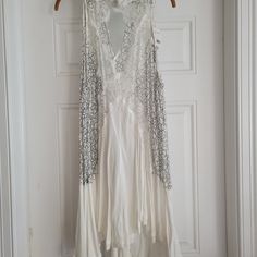 Free People Tell Tale Heart Sleeveless Tank Top Size L, Color Is Ivory Almost White Brand New With Tag White Sleeveless Spring Vest, White Sleeveless Vest For Spring, White Sleeveless Tank Top For Party, White Sleeveless Vest, Elegant White Party Vest, White Tank Top For Party, White Sequined Tank Top For Spring, Spring Wedding Sleeveless Tank Top, White Bohemian Sleeveless Halter Top