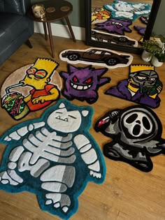 various rugs with cartoon characters on the floor in front of a chair and mirror