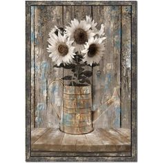 a vase with sunflowers sitting on top of a wooden table next to a wall