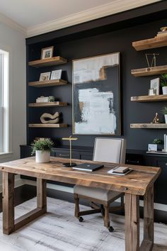 a home office with black walls and wooden shelves