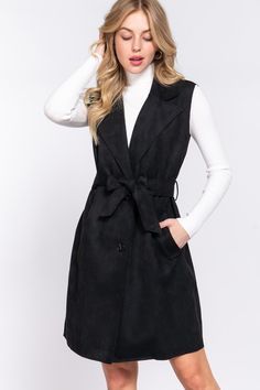 Introducing our stunning faux suede belted vest in timeless black, perfect for any fashion-forward individual. Made with a naturally stretchy fabric, this vest is both comfortable and chic. It features a buckle, removable belt and pockets, making it practical and stylish. The collared neckline with notched lapels and front button closure adds a touch of sophistication to any outfit. This vest is an absolute must-have for your fall and winter wardrobe, and is sure to become a staple piece in no t Collar Vest Outfit, Sleeveless Blazer Vest, Tie Vest, Fashion Vest, Faux Suede Vest, Vest Outfit, Sleeveless Blazer, Gold Outfit, Suede Vest