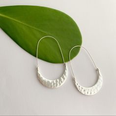 Lustrous Silver-Tone Crescent Moon Hoop Earrings Feature A Hammered Boho Tribal Finish. Size, Color, And Other Details May Vary Slightly Due To The Handmade Nature Of These Earrings. Drop Length: 2.4 Inches Width At Widest Point: 1.4 Inches Materials: Silver Tone Base Metal Drop Hoop Earrings, Earrings Drop, Crescent Moon, Base Metal, Crescent, Handmade Natural, Silver Color, Silver Tone, Jewelry Earrings