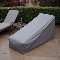 two lounge chairs sitting next to each other on a patio