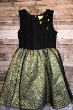 NEW WITHOUT TAGS - THE CHILDREN'S PLACE - HOLIDAY DRESS GIRLS SIZE 6X/7 BLACK / GOLD SLEEVELESS DRESS ZIPPER UP BACK JEWELS ON TOP LACE OVERLAY ON TOP BOTTOM IS GOLD COLORED CHEETAH PRINT WITH BLACK TULLE OVERLAY SKIRT BIN # 34 Fitted Festive Pageant Dress, Fitted Dress For Festive Pageant Occasions, Fitted Holiday Dress For Fall Dress-up, Black Festive Dress For Fall, Fitted Dress For Dress-up Holiday In Fall, Gold Holiday Dress For Festive Occasions, Black Dress For Fall Festival, Gold Dressy Dress For Holidays, Gold Dress For Festive Holiday Season