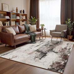 a living room filled with furniture and a large rug