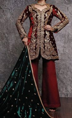 This beautiful short jacket says it all. Elegant maroon velvet jacket with gold tilla aree based, naqshee and zardozi embellishment. Style:Short Jacket Embroidery: Gold tilla aree base, Naqshee & Zardozi embellishments Fabric: Velvet Bottom: CottonSilk Izaar Colour: Maroon Price includes: Jacket, Shawl & Izaar Includes: Jacket Shawl Izaar Traditional Velvet Long Sleeve Salwar Kameez, Designer Velvet Traditional Wear With Long Sleeves, Velvet Long Sleeve Traditional Designer Wear, Velvet Anarkali Traditional Wear With Long Sleeves, Velvet Traditional Wear With Long Sleeves For Festive Occasions, Velvet Salwar Kameez For Wedding With Long Sleeves, Velvet Salwar Kameez With Dupatta And Long Sleeves, Velvet Long Sleeve Salwar Kameez For Wedding, Velvet Long Sleeve Salwar Kameez With Dupatta