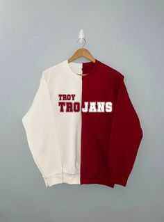 A duo red/white sweatshirt with Troy Trojans or wording. *3 WEEK TURNAROUND DUE TO HANDMADE ITEM *Sweatshirt colors maybe switched from above images University Jacket, Troy Trojans, Troy University, Sweatshirt Colors, Abstract Graphic Design, University Sweatshirts, Abstract Graphic, Red Jacket, White Sweatshirt