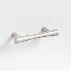 an image of a metal handle on a white wall