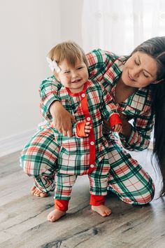 It's time to get festively comfy with our Buttflap PJs - Christmas Plaid! These cozy, matching PJs are just the thing for a magical family night, delivering a dose of festive cheer that no one can ignore. So break out the marshmallows, pop in a Christmas movie, and snuggle up for a night to remember! Ho ho ho! 95%polyester 5%spandex True to size Wash Delicate; Lay Flat to dry Bodysuit: Sizes newborn to12m Two Piece PantSet: Sizes 18m to 12y Elastic waistband Sewn on buttflap Matching Christmas Pajamas Family Aesthetic, Holiday Pajama Photo Shoot, Family Christmas Jammies Photo Shoot, Xmas Pjs Matching, Christmas Pajamas Set, Family Matching Holiday Winter Sleepwear, Family Matching Holiday Festive Sleepwear, Playful Christmas Sleepwear, Family Matching Winter Sleepwear For Bedtime