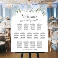 a wedding seating chart with flowers on it