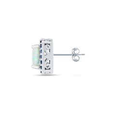 Enhance your look with these precious stud earrings. Sparkling cushion-cut white opal gemstones are set on a polished sterling silver frame surrounded by dazzling round blue sapphire gemstones creating a halo affect. It secures to the ear with post with friction backs. Product Details Metal Type sterling-silver Metal Stamp 925-sterling Weight 4.2GR Length 20.5MM Width 20.5MM Back Finding post-with-friction-back Stone Details Gem Type opal Number of Stones 2 Stone Color white Stone Shape cushion- Cushion Cut Halo, Halo Stud Earrings, Halo Earrings Studs, Square Earrings Studs, Square Stud, Small Earrings Studs, Cz Stud Earrings, Sapphire Gemstone, White Stone