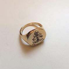 "Coat of Arms Family Crest Ring, Crest Engraved ring, Personalized Ring Engraved Signet ring with Round Seal - Best quality 18k Gold Plate also avaliable in sterling silver - suitable for men and women, Diameter: 15 mm Please note in the \"notes to seller\" at checkout. : * state your ring size * letter/ picture you want to engrave The product will arrive to you packed in gift box and padded envelope to maintain the product Our jewelry are water resistant and comes with 1 year warranty For more Men Pinky Ring, Pinky Ring Gold, Family Crest Ring, Family Crest Rings, Picture Letters, Letter Ring, Signet Rings, Personalized Ring, Etsy Gold Ring