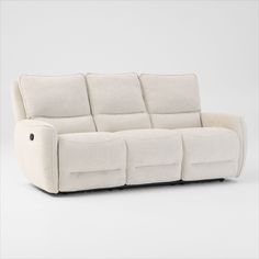 the reclining sofa has four seats and is made out of white fabric with black piping