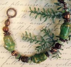 * This modern boho Bracelet goes with so many looks...the forest colors meld beautifully with almost any color palate! Capturing the outdoor shades are Picasso Beads, handmade Ceramic Beads, Copper Spacer Beads, and an Antique Copper Clasp. * Luscious, soft colorations of Mossy Green, Copper, Antique Copper, and Brown create a perfect marriage of Nature's colors. * The Bracelet is very comfortable to wear, and is available in several different lengths; please select your favorite length. * This Desert Shade, Forest Colors, Purple Beaded Bracelets, Forest Color, Mossy Green, Bead Projects, Purple Beaded, Beaded Boxes, Multi Strand Bracelet