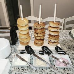 a table topped with donuts and other desserts