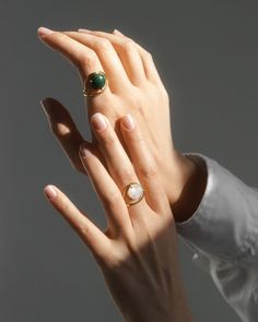 Enviable with its handmade craft the Neon ring features repurposed gold for sustainable shine. The green malachite stone highlights your finger with its cabochon cut. This piece is made to order just for you so please allow 3-6 weeks for your item to ship. This item is final sale. 9k gold (ring) 14k gold (setting) and malachite cabochon Gold: repurposed Clean with soft cloth Stone sourced from India Handmade in Antwerpen Belgium | Nayestones Neon Malachite Ring 8 | Gemstones/Yellow Gold Modern Round Emerald Ring For Formal Occasions, Modern Yellow Gold Cabochon Rings, Modern Gemstone Signet Ring, Luxury Gemstone Open Ring, Formal Emerald Open Ring, Modern Wedding Emerald Ring With Polished Finish, Modern Pearl Open Ring With Polished Finish, Elegant Yellow Gold Rings With Natural Stones, Elegant Yellow Gold Ring With Natural Stones