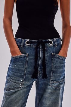 The perfect cool & contemporary addition to any denim drawer from our We The Free collection. **Fit:** Low-slung, slouchy fit with tapered silhouette **Features:** Distressed detailing throughout, paint splatter features, oversized patch pockets, contrast drawstring waist, pull-on style **Why We | We The Free Moxie Pull-On Barrel Jeans at Free People in Medium Wash, Size: 30 L Barrel Jeans, Nye Outfits, Estilo Denim, Blue Fits, Paint Splatter, Western Outfits, Hat Hairstyles, Western Wear, Holiday Outfits