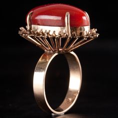 Vintage 1940's 18k Yellow Gold Oval Cabochon AAA Red Coral Solitaire Ring 6.29gMetal Information: 18k Yellow GoldTotal Weight: 6.29gBand Width: 3.4mmSize: 6.25Circa: 1940'sStone InformationMain StoneGem Type: CoralShape: Oval Cabochon (20.2mm x 10.6mm)Color: RedClarity/Quality: AAANumber of Stones: 1Estimated Retail Price: $4975.00OUR PRICE: $3980.00SizingMany of our pieces can be re-sized at the buyers request. Please email us if you require our skilled professional services.45787 Formal Oval Cabochon Ruby Ring In 14k Gold, Red Oval Cabochon Ring For Formal Occasions, Formal Red Domed Rings, Vintage Ruby Ring With Oval Cabochon And Polished Finish, Mid-century Cabochon Jewelry For Formal Occasions, Formal Red Oval Cabochon Ring, Vintage Oval Cabochon Ruby Ring With Polished Finish, Red Oval Cabochon Ring With Polished Finish, 14k Gold Polished Oval Cabochon Ruby Ring