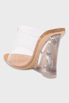 Girl, get ready to obsess over these bomb clear wedge sandals! They've got a see-through upper, a cork insole, and a transparent wedge heel - talk about versatile. Wear 'em with jeans, skirts, or dresses - you can't go wrong. Color: Transparent / Cork Fits true to size for most Heel measures approximately 4.5" Man made materials Vegan friendly Clear Heeled Shoes, Luxury Clear Open Toe Heels, Clear Heels Shoes, Clear Court Shoes, Dresses That Go With Clear Heels, Cork Clutch, Clear Wedges, Shoes Outfit Fashion, Skirts And Dresses